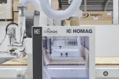 CNC machine operating in a factory, used for precision printing of construction materials.