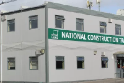 The modern white National Training Campus building at Mount Lucas.