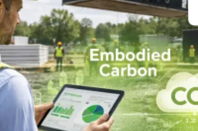 Construction worker in high-vis vest holding tablet, with "Embodied Carbon" and CO2 graphics overlay, Boylan Consulting logo.