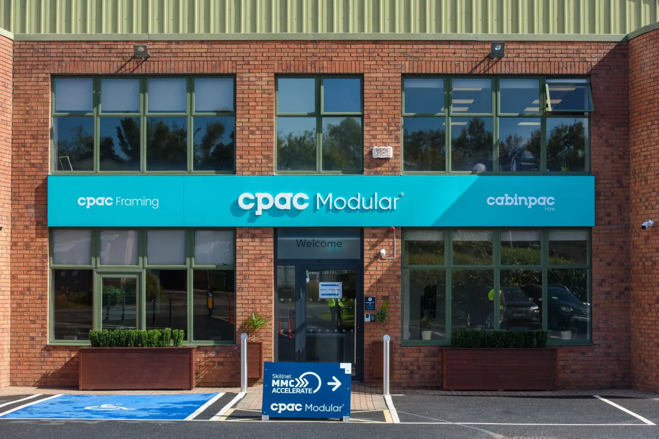 Two-story brick building with teal "cpoc health" sign over the entrance.