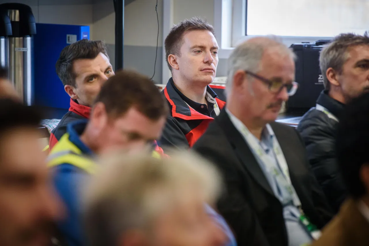 A group of people gathered at what appears to be a professional or business event.