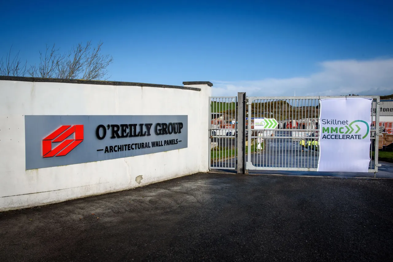 O'Reilly Group architectural solutions facility entrance with signage and open gates.