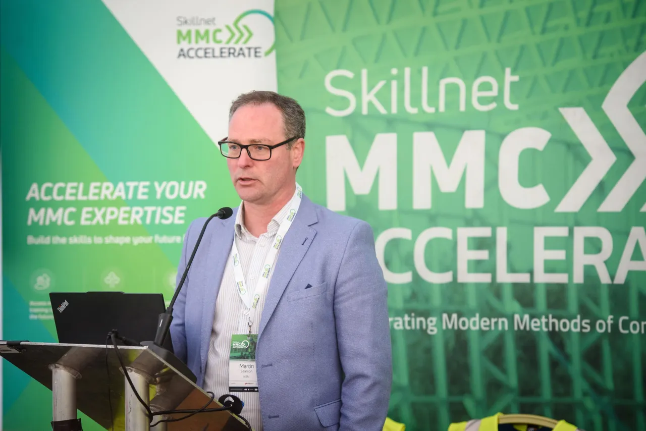 Middle-aged man speaking at a Skillnet MMC Accelerator podium event.