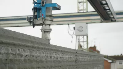 image of 3d printing machine printing a new layer of a house wall 