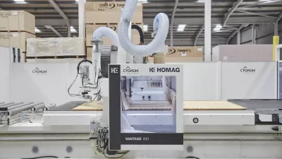 CNC machine operating in a factory, used for precision printing of construction materials.