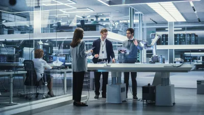 Professional team in modern laboratory environment with sleek workstations and glass walls.