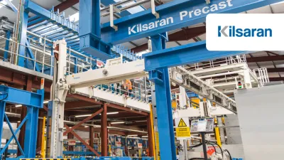 Industrial factory interior with blue overhead crane system labeled "Konecranes" and "Kilsaran"