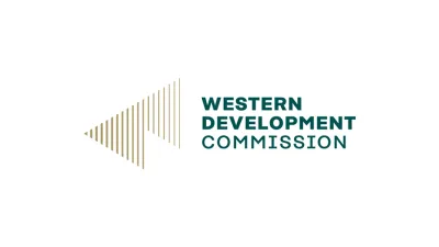 Logo of Western Development Corporation with a gold triangle design to the left.