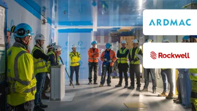 Group of workers in high-vis vests and hard hats during a facility tour, with Ardmac and Rockwell logos.