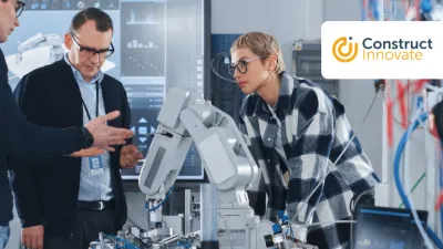 Group of people working with a robert at the lab