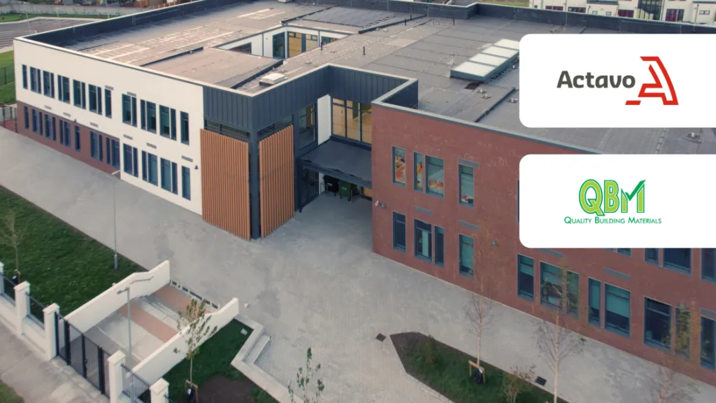 Aerial view of a modern brick school building with Actavo and QSM company logos overlaid.
