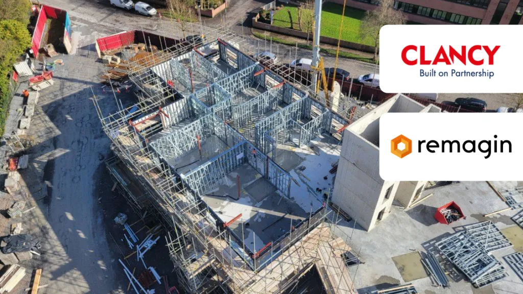 Aerial view of an active construction site with steel framework, featuring Clancy and Remagin logos.