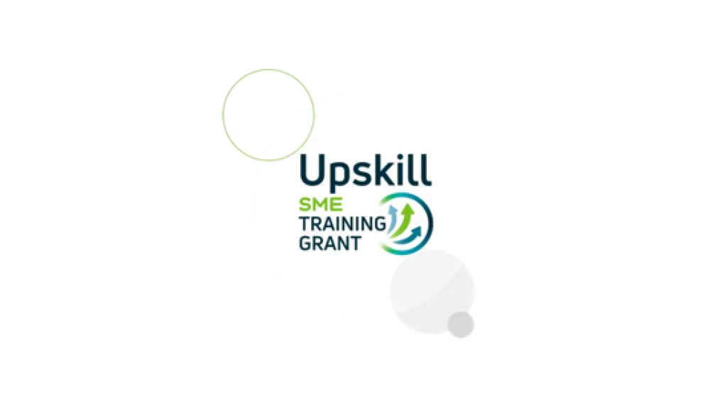 Logo for "Upskill with Training Grant" with circular green and blue design elements.