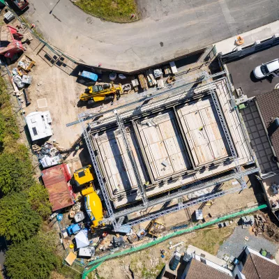 Overhead view of a construction site where a house is being built.