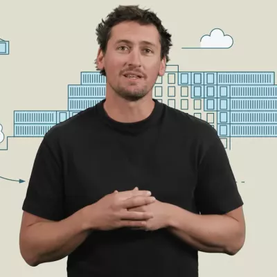 Person standing in front of a graphic illustration of a building.