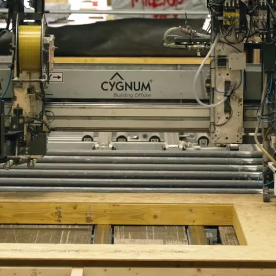 A piece of metal engineering equipment with branding for the company Cygnum on it.