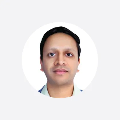 Professional headshot of a person in a white shirt against a white circular background.