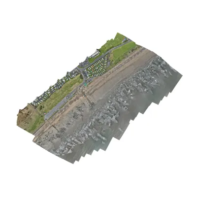 3D model of a terrain section with a dirt path, green grass, and rocky border.